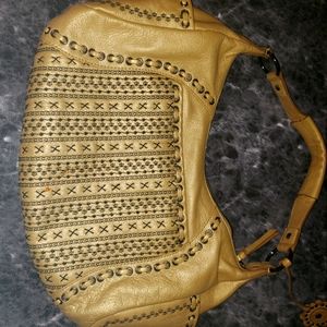 Authentic Isabelle Fiore. GOLD WITH BLACK STITCH.